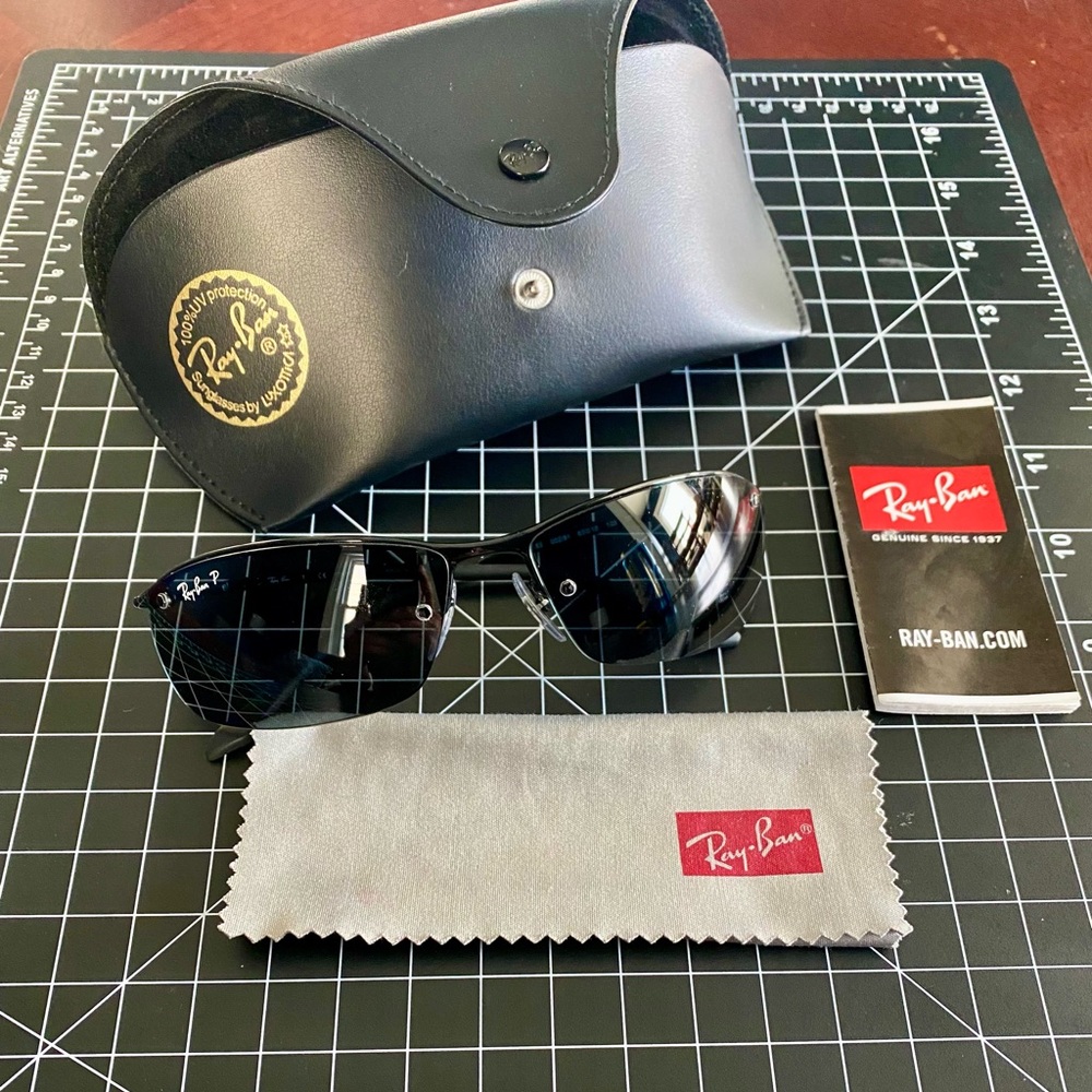 Ray-Ban Sunglasses by Luxottica, 100% UV Protection, Color black and grey.